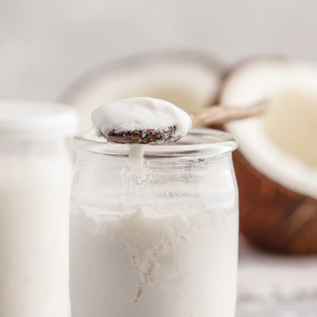 homemade-coconut-yogurt-in-a-glass-jar-on-the-table-healthy-vegan-picture-id990585538