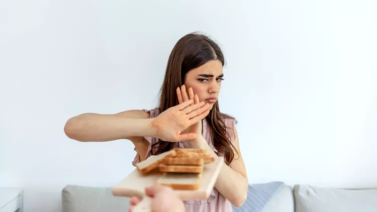 woman eats bread