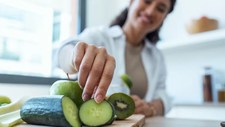woman eating cucumbers