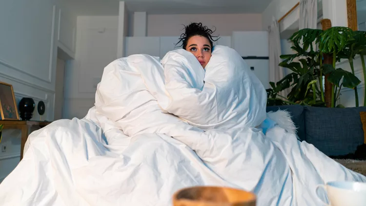 sofa woman blanket