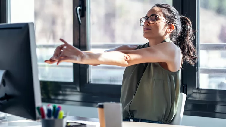 streching at the office desk