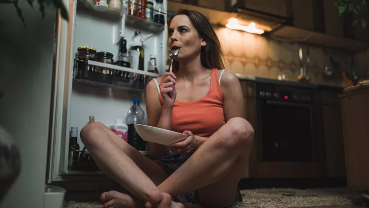 Woman looking for midnight snack