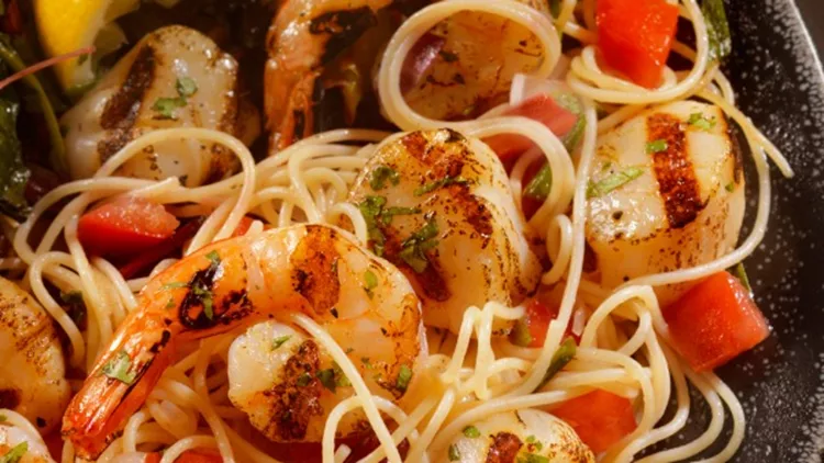 shrimp-and-scallops-with-pasta-picture-id489343622