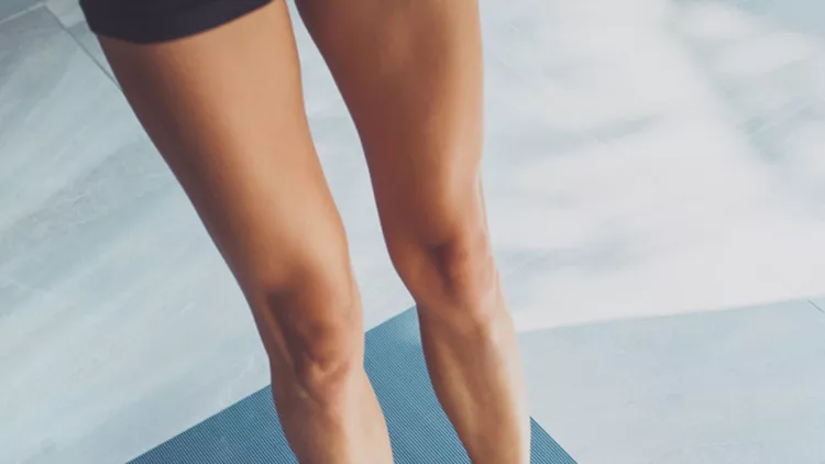 Sporty woman doing exercise in a gym