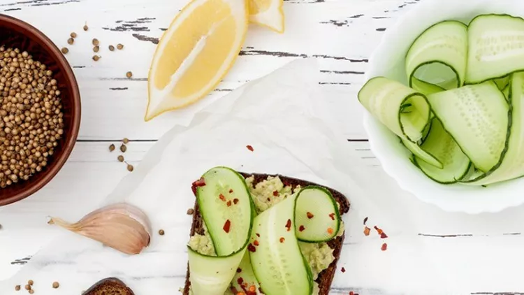 toast-with-avocado-guacamole-and-cucumber-slices-spicy-avocado-picture-id623210764