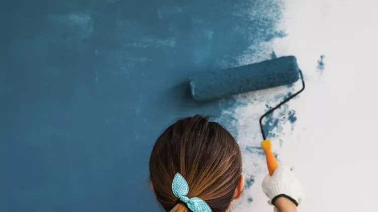 young-asian-happy-woman-painting-interior-wal-picture-id891455684