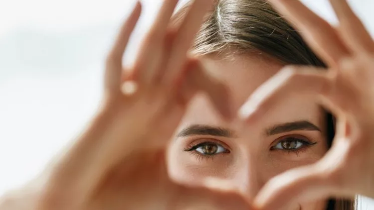beautiful-happy-woman-showing-love-sign-near-eyes-picture-id943085232 (1)