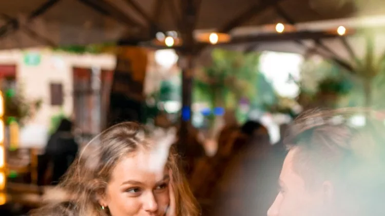 young-couple-enjoying-their-coffee-in-a-bar-picture-id1055287230