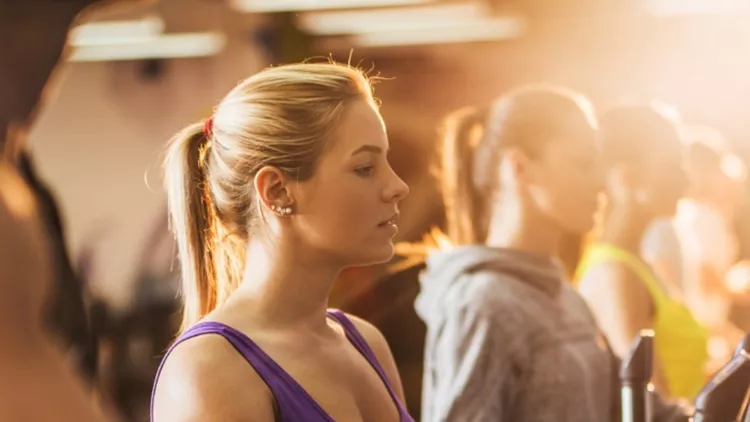 group-of-people-exercising-on-exercise-machine-in-a-gym-picture-id474091786