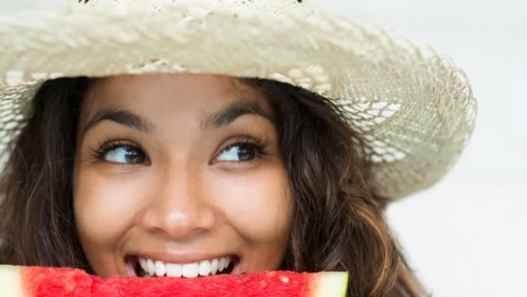 closeup-of-nice-woman-eating-slice-of-watermelon-picture-id680653924 (1)
