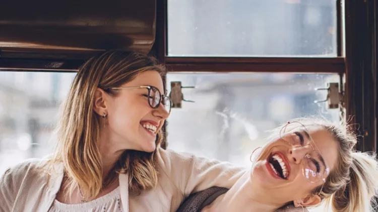 happy-girls-hugging-in-tramcar-picture-id901694358