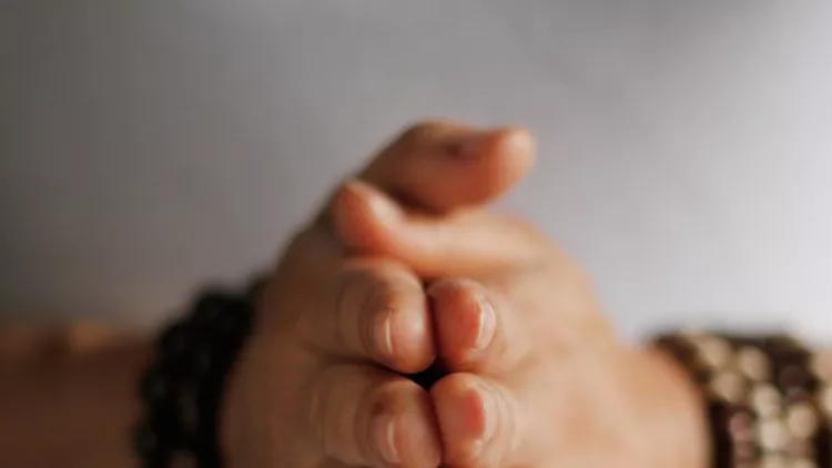 woman-hand-yoga-pose-practicing-meditation-and-praying-indoors-picture-id935229156