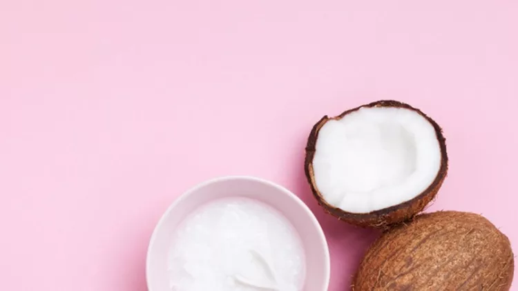 coconuts-fruit-with-coconut-oil-on-pink-pastel-table-top-view-beauty-picture-id985057734