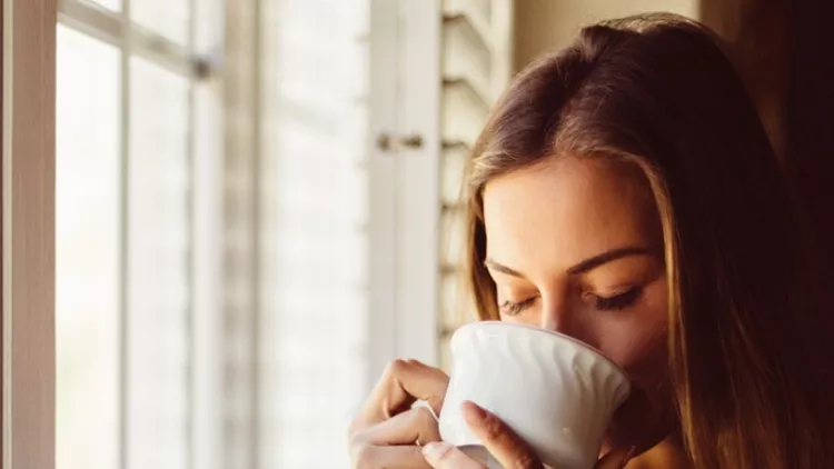 woman-drinking-coffee-early-in-the-morning-picture-id545095864