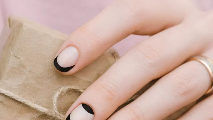 female-hands-with-black-french-nail-design-picture-id918813218