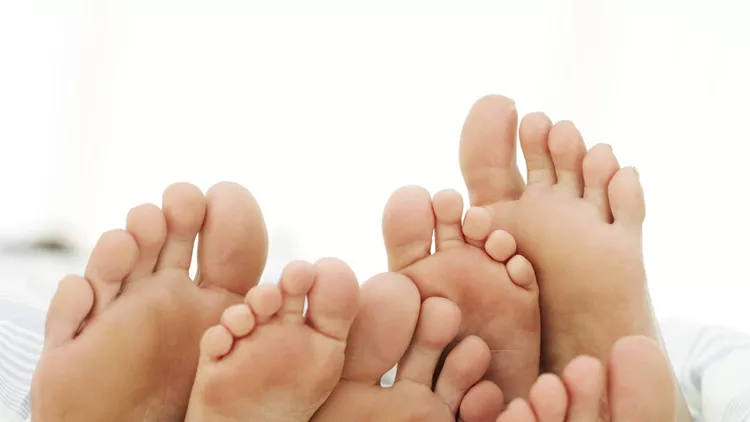 Soles of a Couple and Their Child