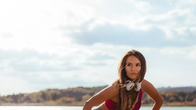 fit-young-woman-doing-side-lunge-picture-id940399250