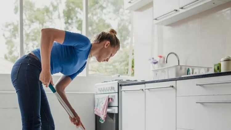 young-female-cleaning-floor-picture-id887388516