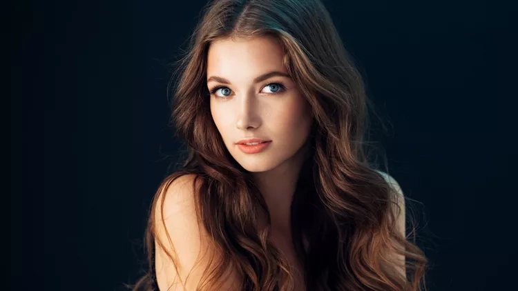 ? Young beautiful model with long wavy well groomed hair
