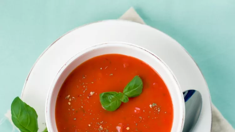 tomato-soup-with-fresh-basil-picture-id597927546