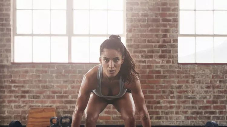 female-performing-deadlift-exercise-with-weight-bar-picture-id534213550