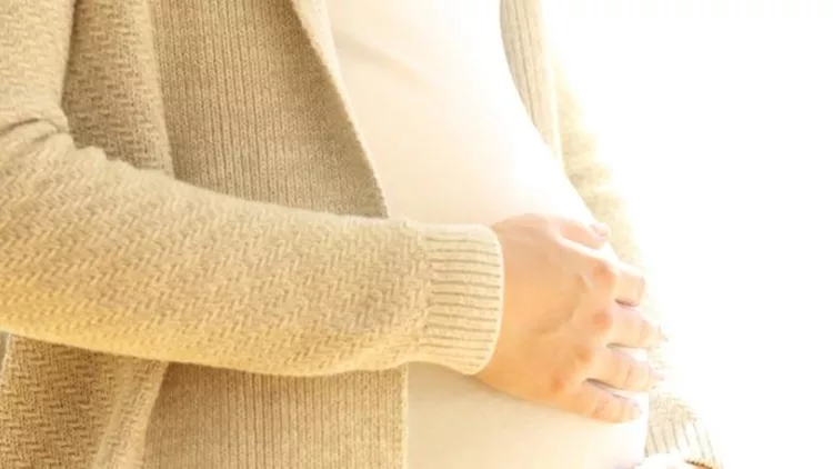 close-up-of-a-pregnant-woman-holding-belly-picture-id862267536