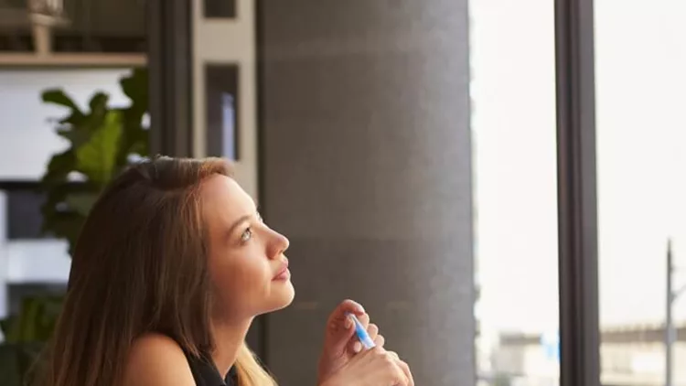 businesswoman-working-in-an-office-looking-out-of-the-window-picture-id639468294