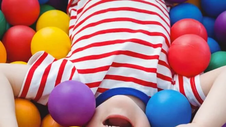 cute-smiling-boy-in-sponge-ball-pool-picture-id666530674