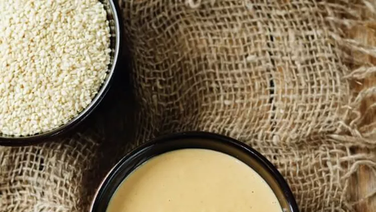 tahini-sesame-paste-with-sesame-seeds-picture-id896690728