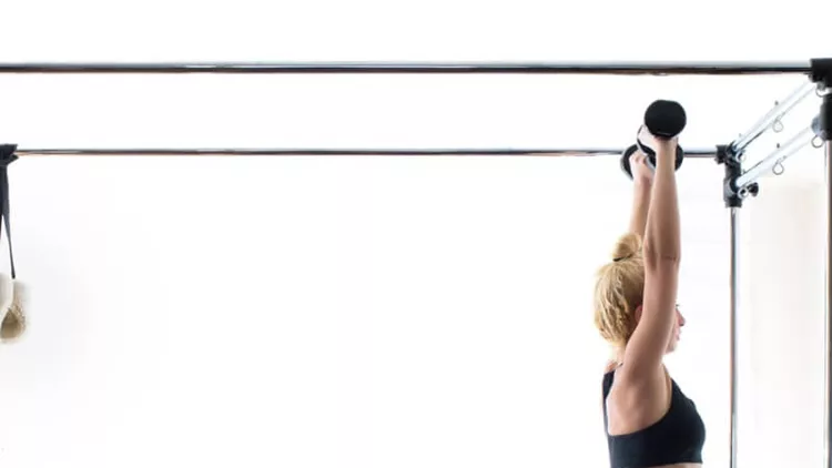 woman-pilates-reformer-exercises-fitness-isolated-picture-id857790238
