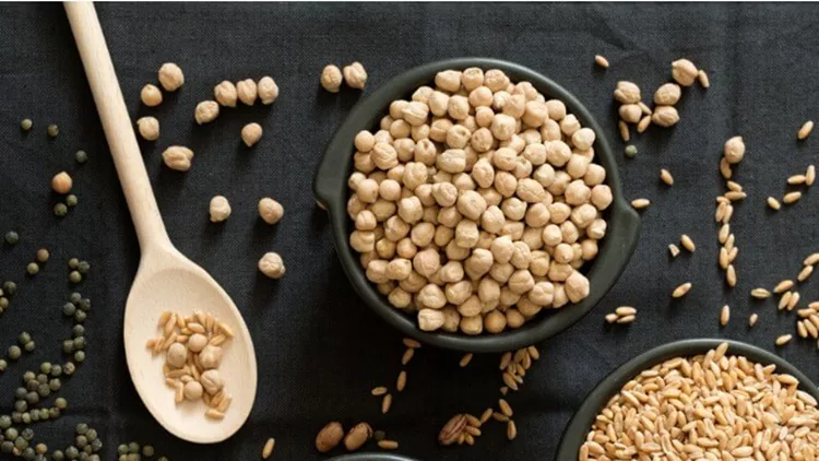 legume-family-in-the-black-bowls-on-the-table-picture-id665366284