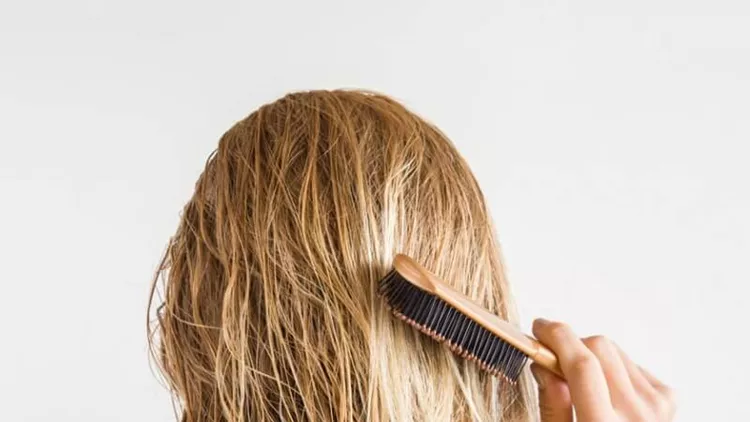woman-with-comb-brushing-her-wet-blonde-hair-after-shower-on-the-gray-picture-id858537420 (1)