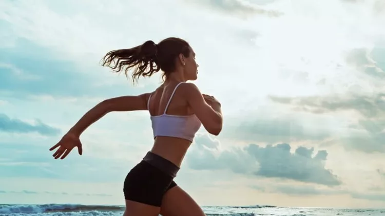 active-sporty-woman-run-along-sunset-ocean-beach-sports-background-picture-id638688656