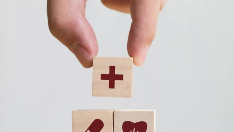 hand-arranging-wood-block-stacking-with-icon-healthcare-medical-for-picture-id917079152