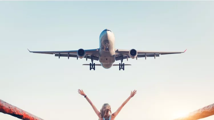 airplane-and-woman-at-sunset-summer-landscape-with-girl-standing-on-picture-id816320482