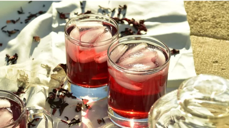 cold-summer-ice-tea-made-with-hibiscus-flower-petals-picture-id990693990
