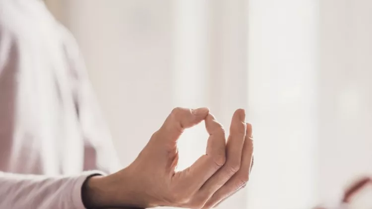 woman-meditating-at-home-girl-practicing-yoga-in-yoga-class-picture-id868876154