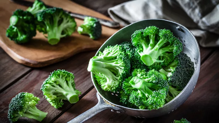 Broccoli in an old metal colander