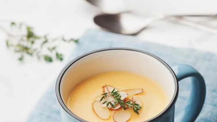 dietary-vegetable-cream-soup-from-carrot-pumpkin-and-potato-decorated-picture-id666960300