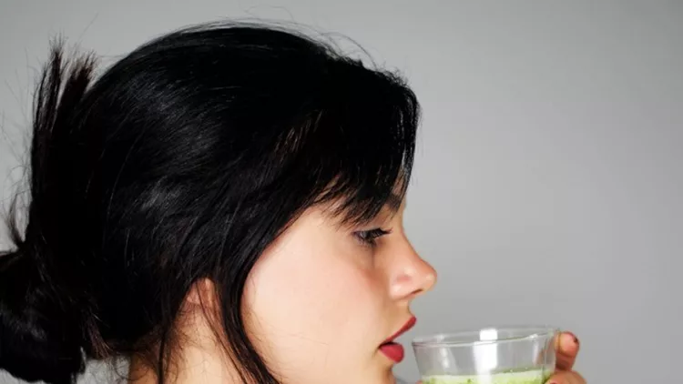 young-woman-drinking-healthy-detox-picture-id1026627410