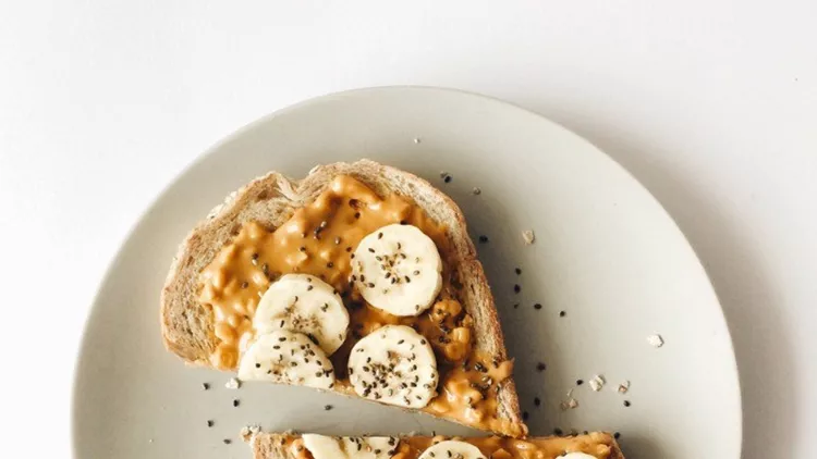 peanut-butter-with-banana-toast-for-breakfast-picture-id1054289824