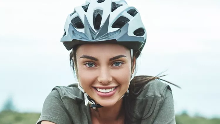 mountain-biking-woman-with-fatbike-enjoys-summer-vacation-close-up-picture-id1053078060