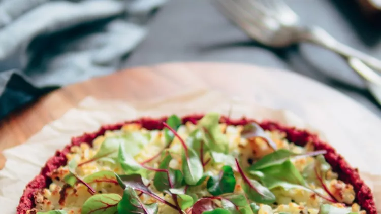 beetroot-pizza-crust-with-fresh-mangold-leaves-picture-id984065418