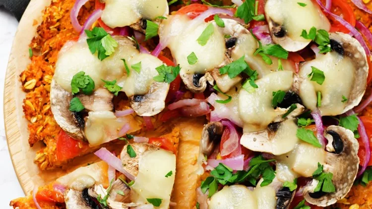 sweet-potato-pizza-crust-with-tomato-red-onion-and-mushrooms-picture-id667311432