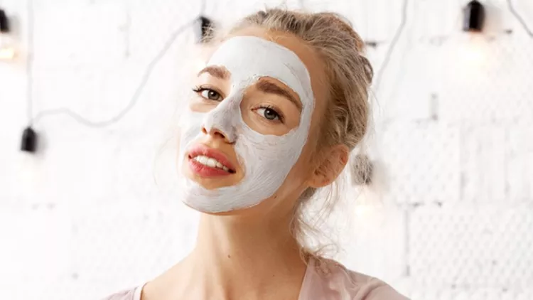 young-cute-woman-using-cosmetic-mask-picture-id1037736474