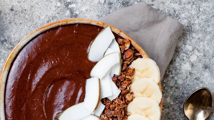 healthy-breakfast-bowl-chocolate-banana-smoothie-bowl-with-coconut-picture-id891697758