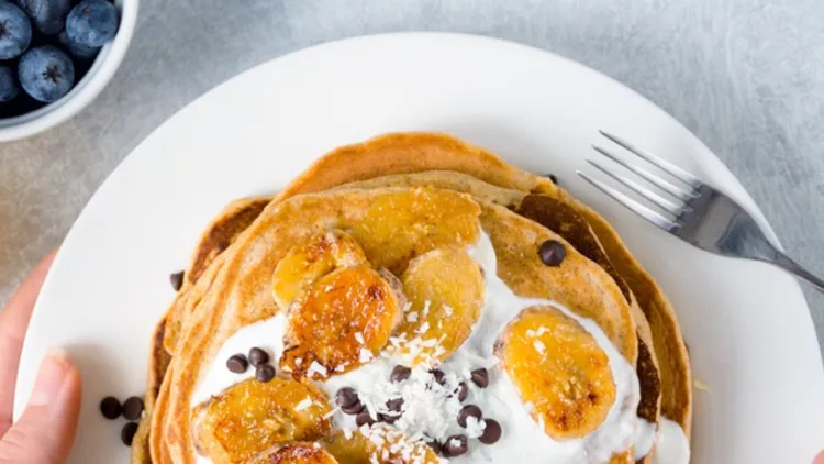 pancakes-with-caramelized-bananas-and-yogurt-sauce-picture-id651614484