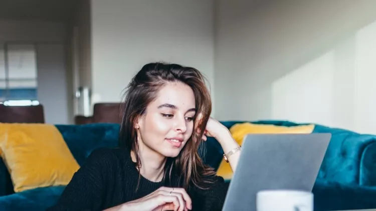 young-woman-using-laptop-at-home-picture-id1059245842