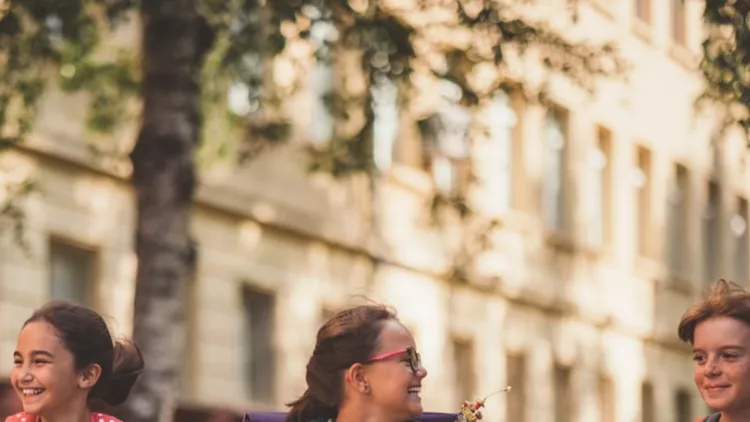 joyful-school-children-running-outside-picture-id1069165862