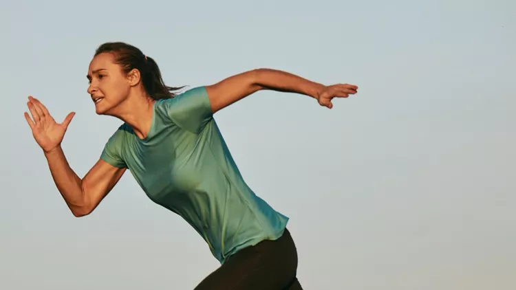 woman-running-hard-and-sweating-picture-id943890958